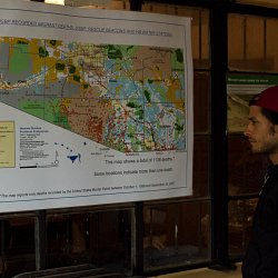 Gael Garcia Bernal looks at a map depicting the locations of the remains of migrants (photo by Marc Silver)