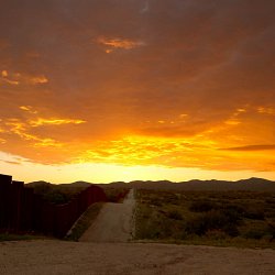 Sunset over the border wall (photo by Marc Silver)